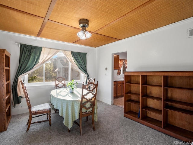 6801 W 52nd Ave, Arvada, CO 80002 - dining room featuring carpet, crown molding, and baseboards