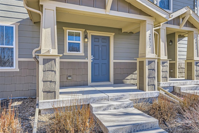 property entrance featuring covered porch