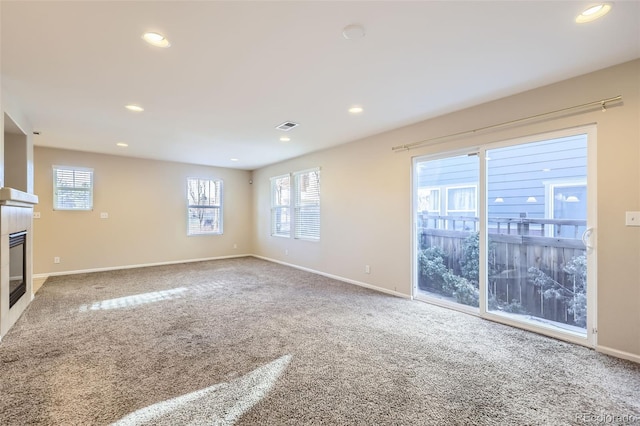 unfurnished living room with carpet floors