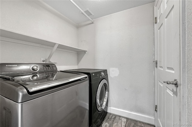 3630 Sawgrass Trl, Castle Rock, CO 80109 - laundry room featuring wood finished floors, washing machine and dryer, and baseboards