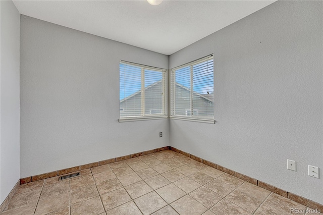3630 Sawgrass Trl, Castle Rock, CO 80109 - spare room featuring baseboards and light tile patterned flooring