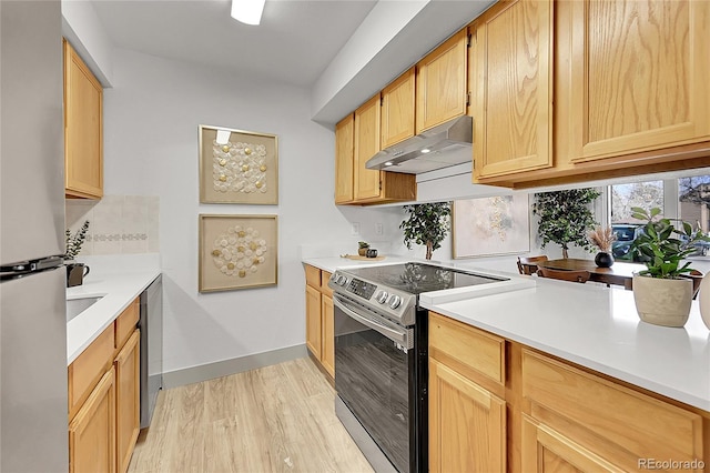 kitchen with stainless steel appliances, tasteful backsplash, light hardwood / wood-style flooring, extractor fan, and light brown cabinetry