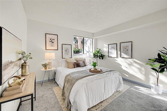 carpeted bedroom with a textured ceiling