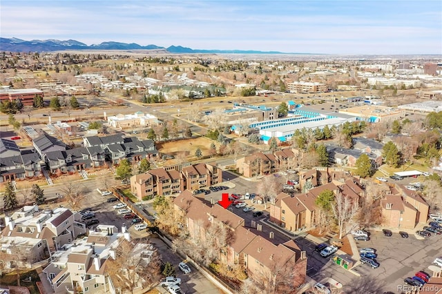 birds eye view of property with a mountain view