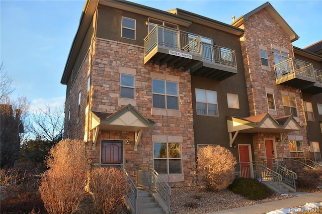 view of front of house with a balcony