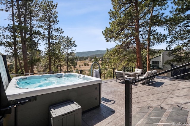 31607 Broadmoor Dr, Evergreen, CO 80439 - view of pool featuring a hot tub, a mountain view, and a patio area