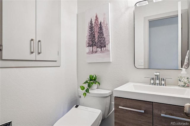 31607 Broadmoor Dr, Evergreen, CO 80439 - bathroom with vanity, toilet, and a textured wall
