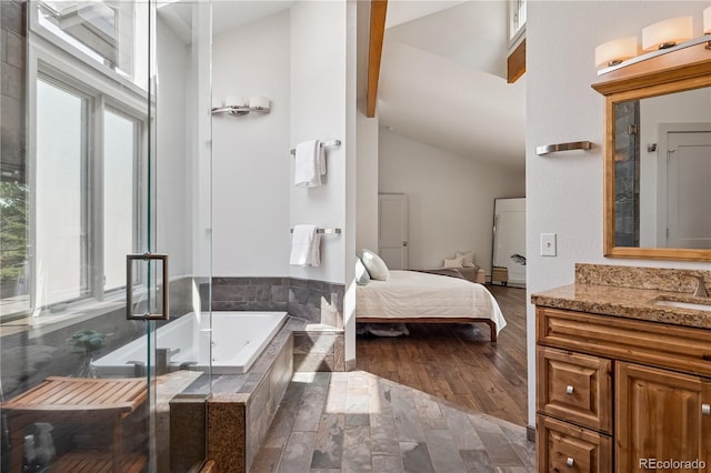 31607 Broadmoor Dr, Evergreen, CO 80439 - full bath featuring vanity, a bath, a shower stall, ensuite bath, and high vaulted ceiling