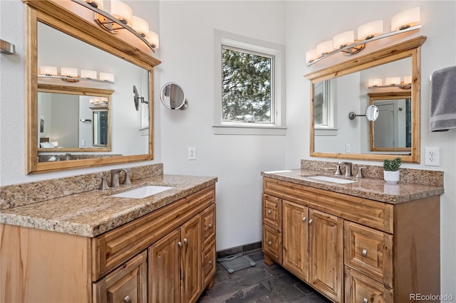 31607 Broadmoor Dr, Evergreen, CO 80439 - bathroom featuring two vanities and stone finish floors