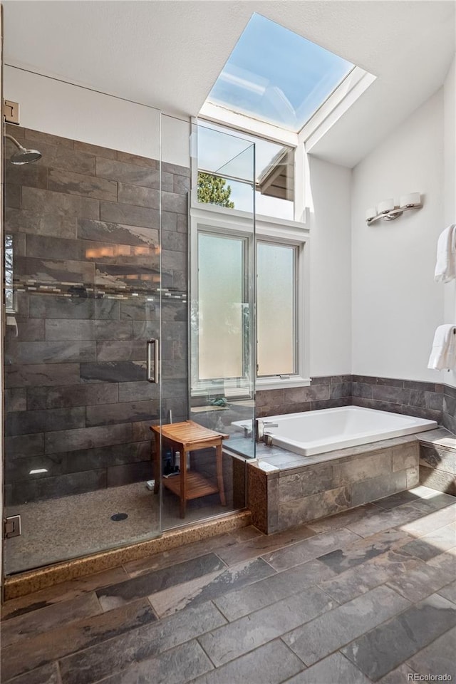 31607 Broadmoor Dr, Evergreen, CO 80439 - full bath with a garden tub, stone tile flooring, and a stall shower