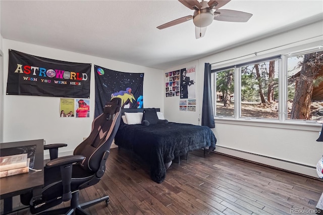 31607 Broadmoor Dr, Evergreen, CO 80439 - bedroom with baseboard heating, wood-type flooring, and a ceiling fan