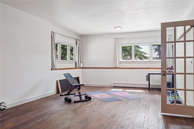 31607 Broadmoor Dr, Evergreen, CO 80439 - workout area featuring a baseboard radiator, hardwood / wood-style flooring, and plenty of natural light