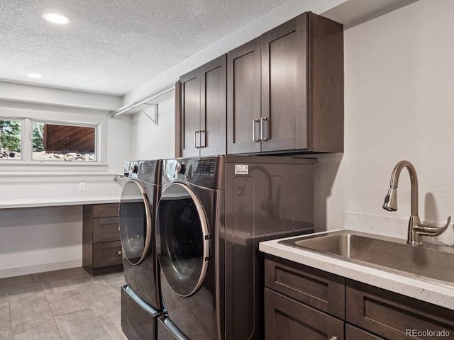 31607 Broadmoor Dr, Evergreen, CO 80439 - washroom featuring cabinet space, washer and dryer, a textured ceiling, and recessed lighting