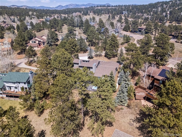 31607 Broadmoor Dr, Evergreen, CO 80439 - aerial view of residential area featuring a mountainous background