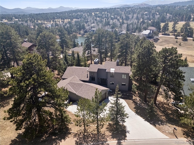 31607 Broadmoor Dr, Evergreen, CO 80439 - aerial view of property and surrounding area featuring mountains