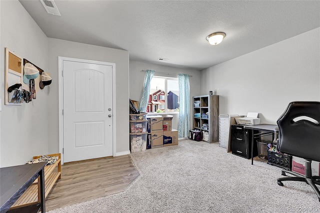 10684 Calista Way, Fountain, CO 80817 - office space featuring wood finished floors and a textured ceiling