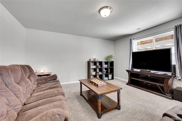 10684 Calista Way, Fountain, CO 80817 - carpeted living area with baseboards and a textured ceiling