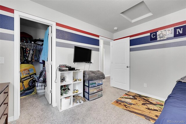 10684 Calista Way, Fountain, CO 80817 - bedroom with attic access, carpet, a closet, and a spacious closet