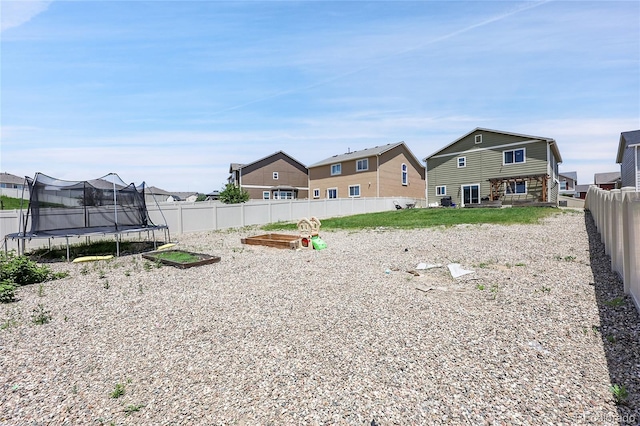10684 Calista Way, Fountain, CO 80817 - fenced backyard with a trampoline and a residential view