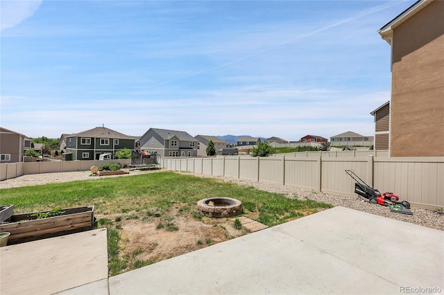 10684 Calista Way, Fountain, CO 80817 - fenced backyard with a residential view, a fire pit, a patio area, and a garden