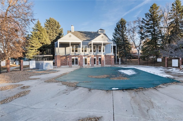 community pool featuring fence