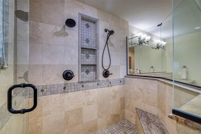 bathroom with a shower with shower door