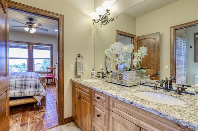 bathroom with ceiling fan and vanity