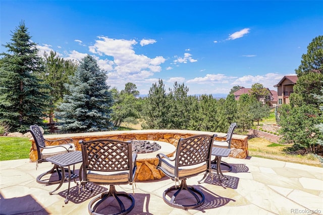 view of patio featuring an outdoor fire pit