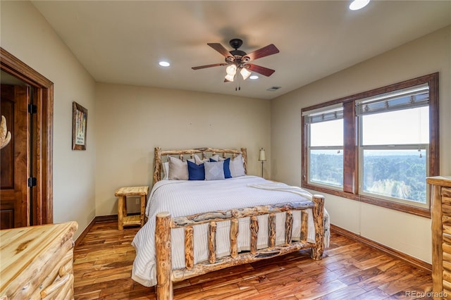 bedroom featuring ceiling fan and wood-type flooring