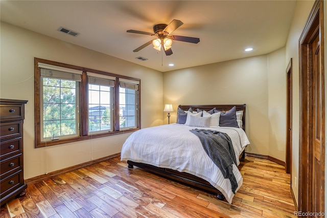 bedroom with light wood-type flooring and ceiling fan