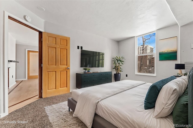 bedroom featuring light colored carpet