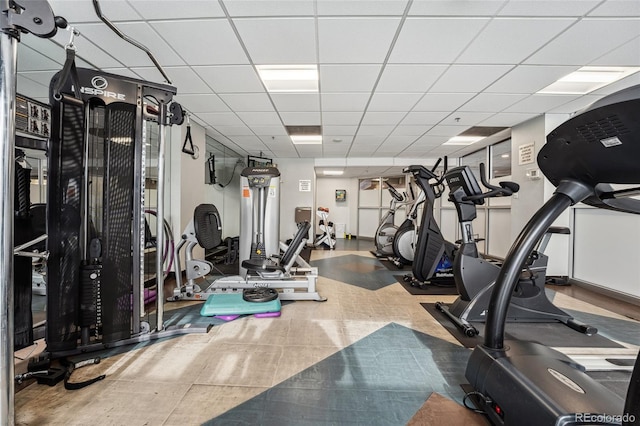 exercise room featuring a paneled ceiling