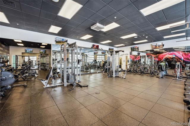 workout area with a paneled ceiling