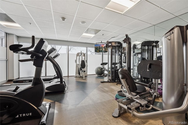 workout area featuring a drop ceiling