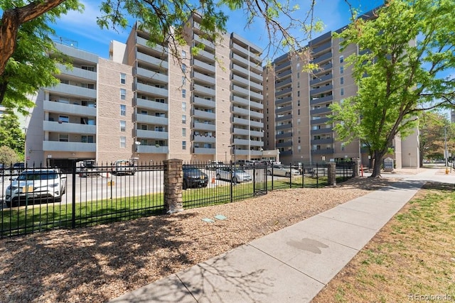 view of building exterior featuring fence