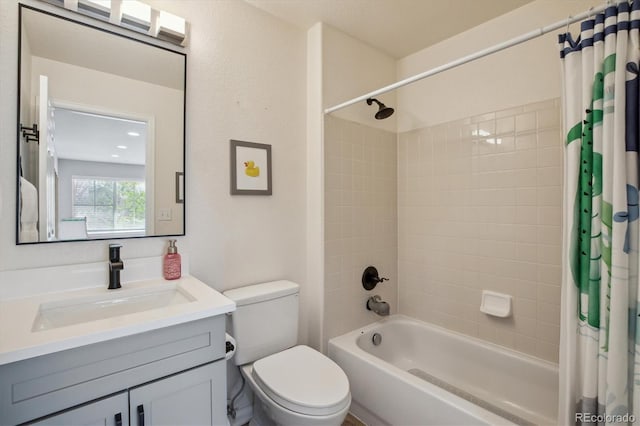 bathroom featuring shower / bath combo, toilet, and vanity