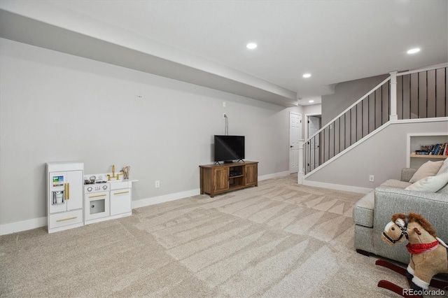 carpeted living room with recessed lighting, stairway, and baseboards