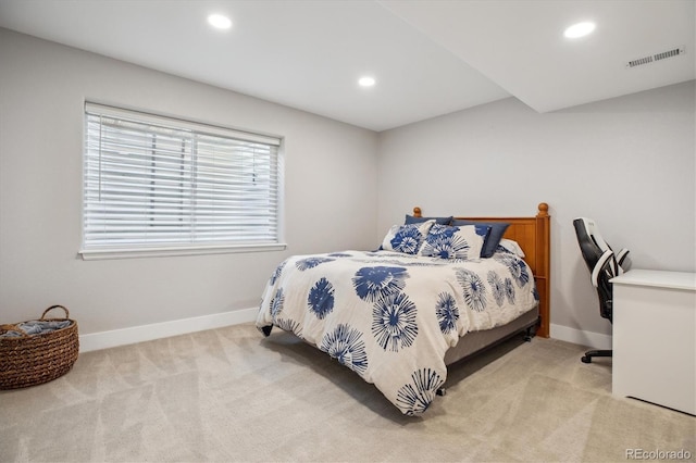 bedroom with light colored carpet, recessed lighting, and baseboards