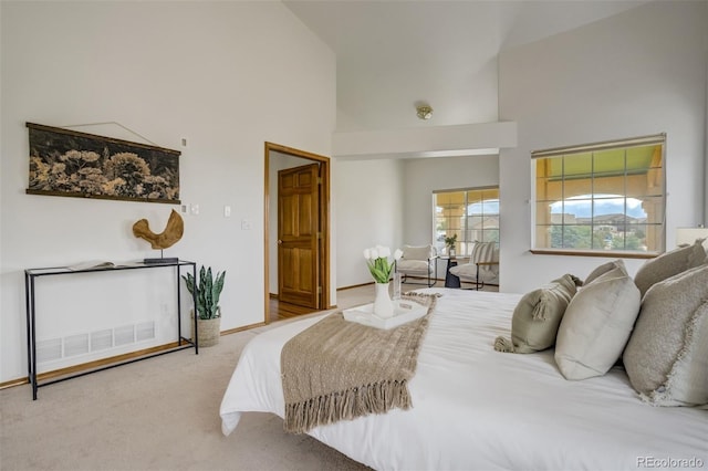 9950 Keating Dr, Peyton, CO 80831 - bedroom with high vaulted ceiling and carpet flooring