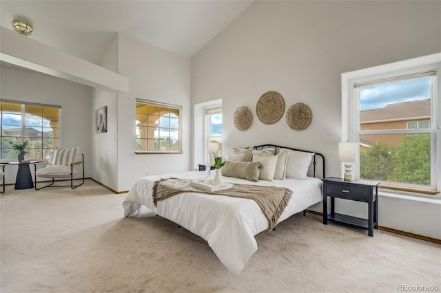 9950 Keating Dr, Peyton, CO 80831 - bedroom featuring high vaulted ceiling and light carpet