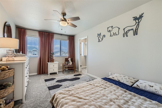 carpeted bedroom with baseboards and a ceiling fan