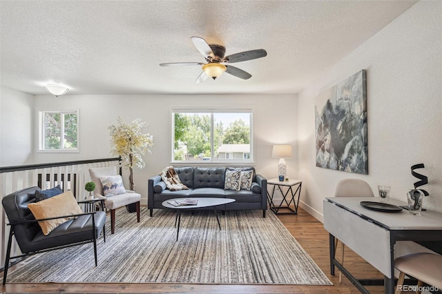 18355 W 59th Dr, Golden, CO 80403 - living area with a textured ceiling, wood finished floors, and a ceiling fan