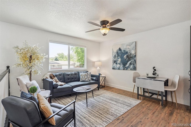 18355 W 59th Dr, Golden, CO 80403 - living area with wood finished floors, a ceiling fan, and a textured ceiling