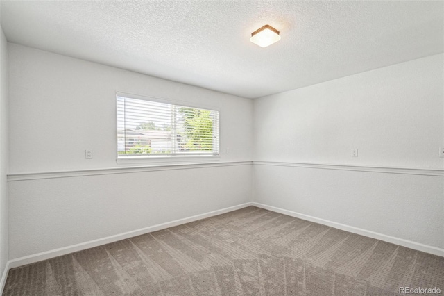 18355 W 59th Dr, Golden, CO 80403 - carpeted empty room with baseboards and a textured ceiling