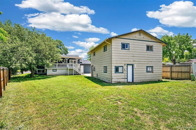 18355 W 59th Dr, Golden, CO 80403 - rear view of house with a fenced backyard, stairs, and a deck