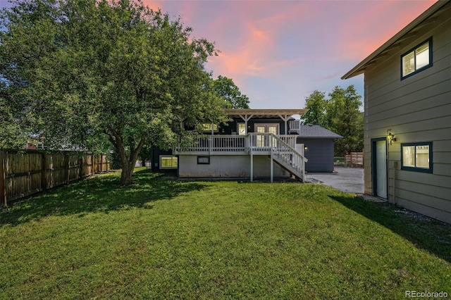 18355 W 59th Dr, Golden, CO 80403 - yard at dusk featuring a deck and stairs