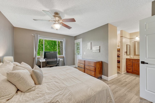 1572 W Long Ave, Littleton, CO 80120 - bedroom featuring light wood-style flooring, a textured ceiling, a ceiling fan, and ensuite bath