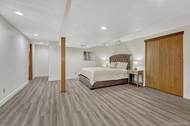 1572 W Long Ave, Littleton, CO 80120 - bedroom with light wood finished floors and recessed lighting