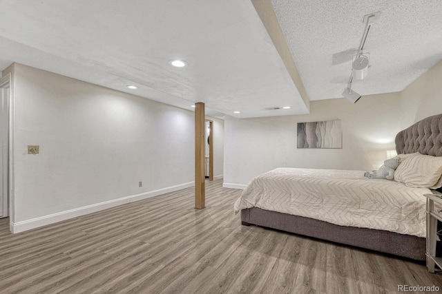 1572 W Long Ave, Littleton, CO 80120 - bedroom with wood finished floors, recessed lighting, and a textured ceiling