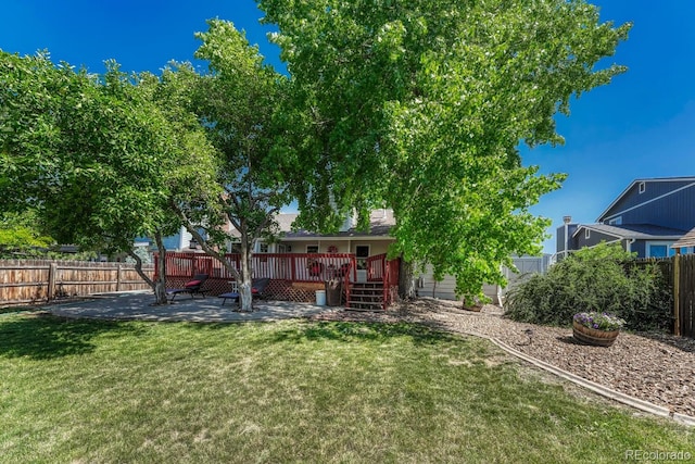 1572 W Long Ave, Littleton, CO 80120 - fenced backyard with a wooden deck and a patio